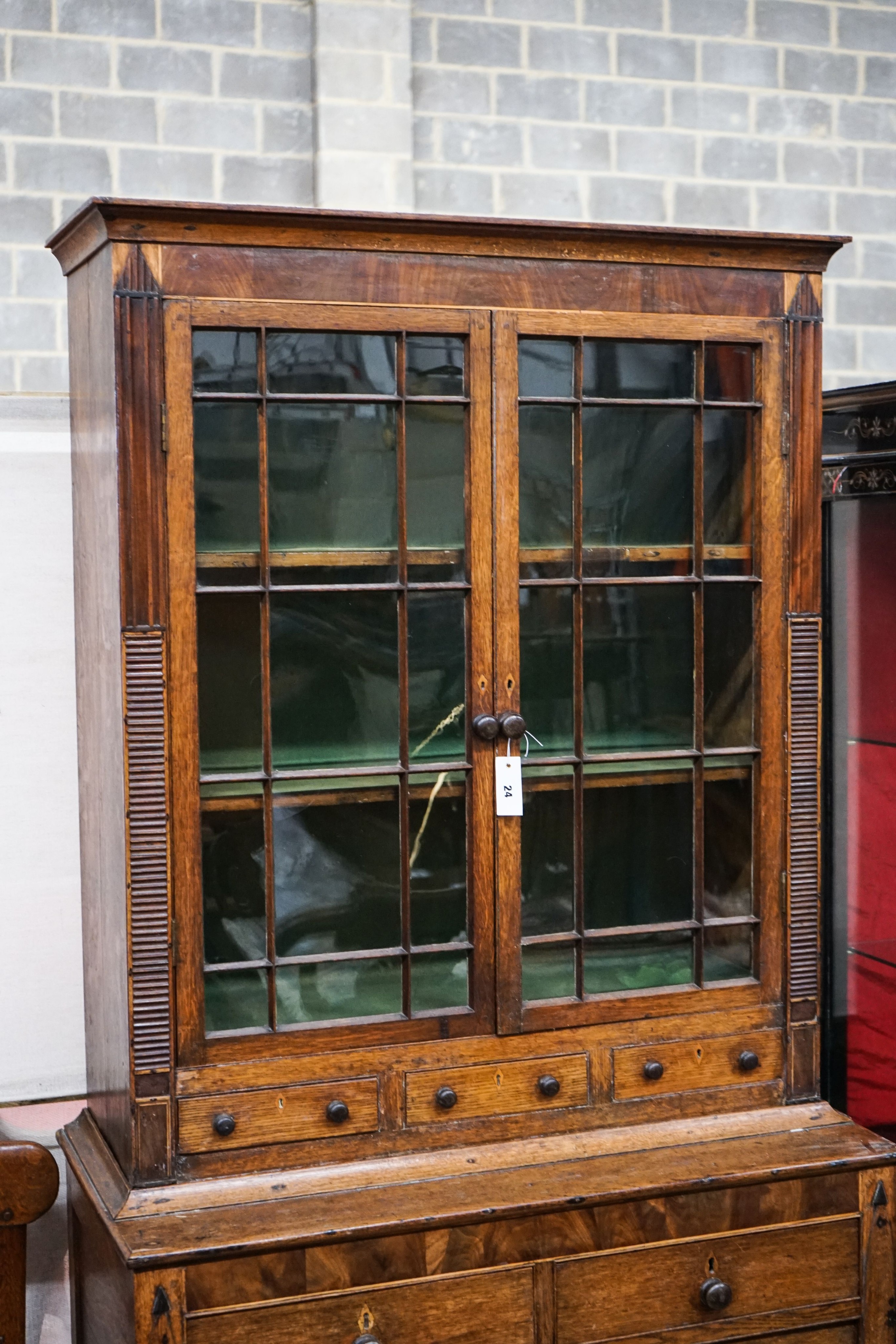 A George IV oak and mahogany bookcase on chest, width 97cm, depth 47cm, height 202cm